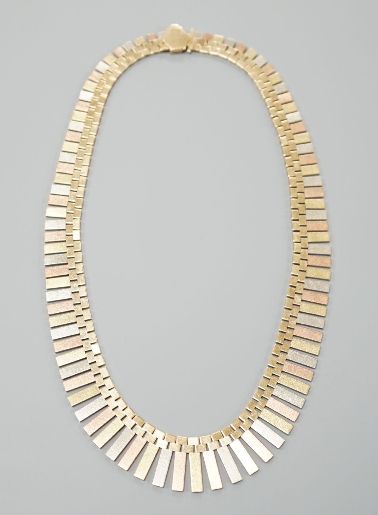 A modern three colour 9ct gold fringe necklace, 40cm, 46.7 grams.